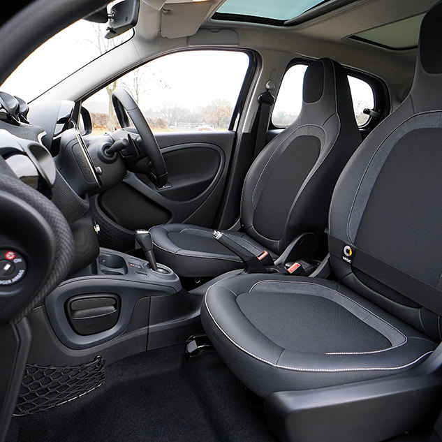 Looking inside drivers side door at black interior of car